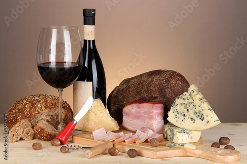 Photo: Exquisite still life of wine, cheese and meat products Exquisite still life of wine, cheese and meat products