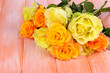 Photo: Beautiful bouquet of roses on table close-up Beautiful bouquet of roses on table close-up