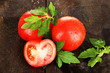 Fresh tomatoes on wooden table close-up