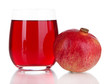 Glass of fresh garnet juice isolated on white