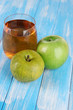 Glass of fresh apple juice on table close-up