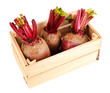Young beets on wooden box  isolated on white