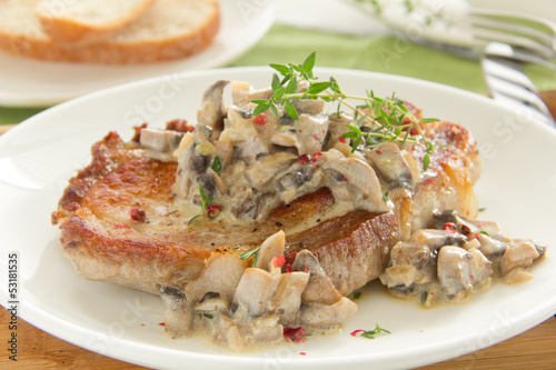 Photo: Pork steak with mushroom sauce and cream. Pork steak with mushroom sauce and cream.