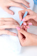 Man doing manicure in salon