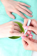 Man doing manicure in salon