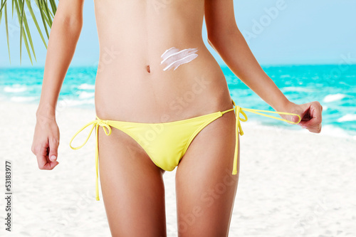 Photo: Sexy summeg girl belly with cream Sexy summeg girl belly with cream