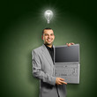 Photo: Idea Concept businessman with open laptop in his hands Idea Concept businessman with open laptop in his hands