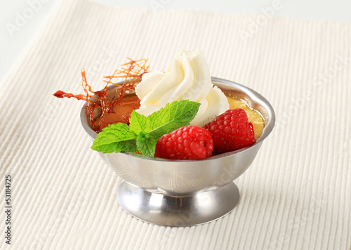 Photo: Creme brulee with raspberries and whipped cream Creme brulee with raspberries and whipped cream