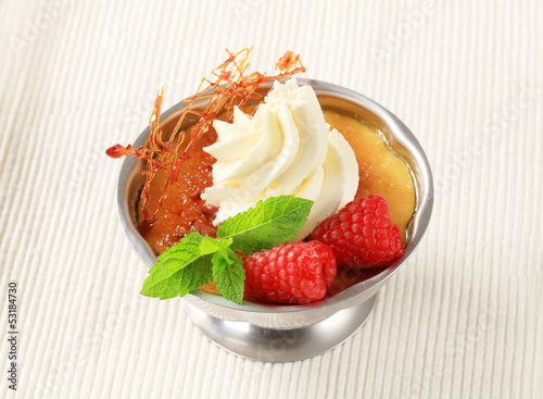 Photo: Creme brulee with raspberries and whipped cream Creme brulee with raspberries and whipped cream
