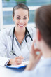Foto : Female doctor talking to patient Female doctor talking to patient