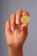 Foto: Coin in hand. Coin in hand.