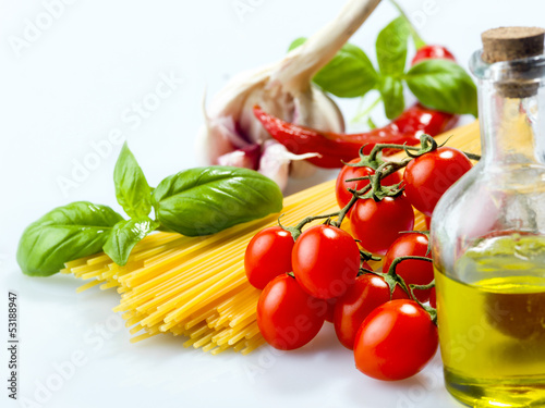 Photo: pasta spaghetti vegetables, spices and oil pasta spaghetti vegetables, spices and oil