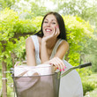 beautiful smiling young woman with bicycle