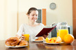 Young woman having breakfast