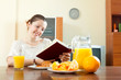 Young woman having breakfast
