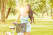 Young woman with bicycle