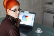 Redhead Businesswoman With Lap...