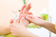 Photo: Woman in nail salon receiving hand massage Woman in nail salon receiving hand massage