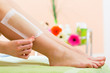 Woman in Spa getting leg waxed