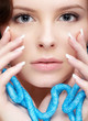 woman with teal beads