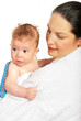 Mother holding baby boy after bath