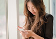 woman uses a smartphone