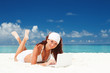 Cute woman with white laptop on the summer beach