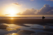 Surfer  at the beach at sunset