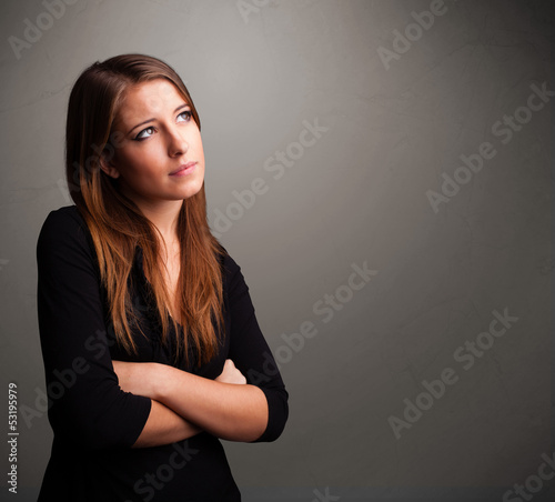 Photo: Beautiful woman thinking with empty copy space Beautiful woman thinking with empty copy space