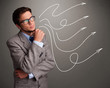 Photo: Attractive man looking at multiple curly arrows Attractive man looking at multiple curly arrows