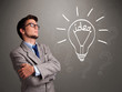 Photo: Young boy comming up with a light bulb idea sign Young boy comming up with a light bulb idea sign