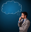 Photo: Young man smoking cigarette with idea cloud Young man smoking cigarette with idea cloud