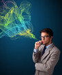 Handsome man smoking cigarette with colorful smoke