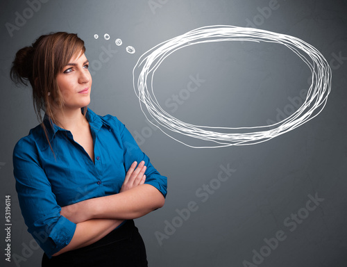 Photo: Young lady thinking about speech or thought bubble with copy spa Young lady thinking about speech or thought bubble with copy spa