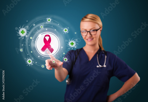Photo: Young nurse pressing modern medical type of buttons Young nurse pressing modern medical type of buttons