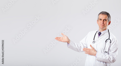Photo: Doctor listening to empty copy space with stethoscope Doctor listening to empty copy space with stethoscope