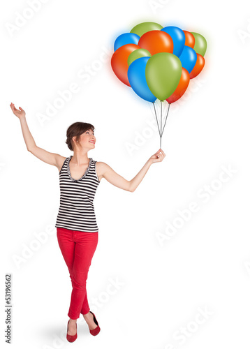 Photo: Young woman holding colorful balloons Young woman holding colorful balloons