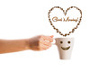Photo: Coffee mug with coffee beans shaped heart with good morning sign Coffee mug with coffee beans shaped heart with good morning sign