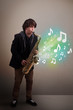 Young musician playing on saxophone while musical notes explodin