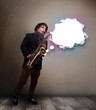 Young man playing on saxophone with copy space in white cloud