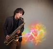 Attractive musician playing on saxophone with colorful abstract