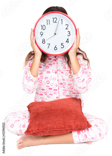 Photo: Child in pajamas wearing a clock in place of her face Child in pajamas wearing a clock in place of her face