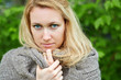 Photo: Portrait of woman in grey hand-knitted jacket Portrait of woman in grey hand-knitted jacket