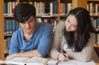 Two concentrated students learning