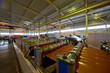 Line for forming shaped metal sheets