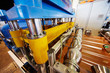 Automated line for forming shaped metal sheets