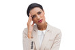 Tired businesswoman holding her head