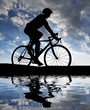 Illustration: silhouette of the cyclist riding a road bike at sunset silhouette of the cyclist riding a road bike at sunset