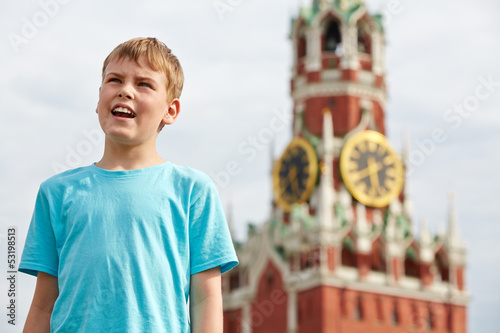 Photo: Portrait of boy in blue t-shirt against Spassky tower of Moscow Portrait of boy in blue t-shirt against Spassky tower of Moscow