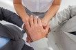 Business people gathering their hands together